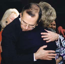 President Witt hugs Judy Stout Smith
