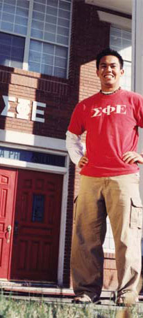 Chad Tolentino in front of Sigma Phi Epsilon House