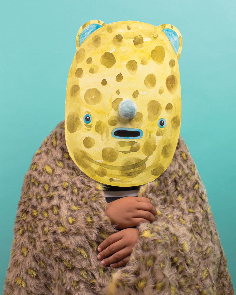 Person wearing one of a yellow mask and leopard shaw