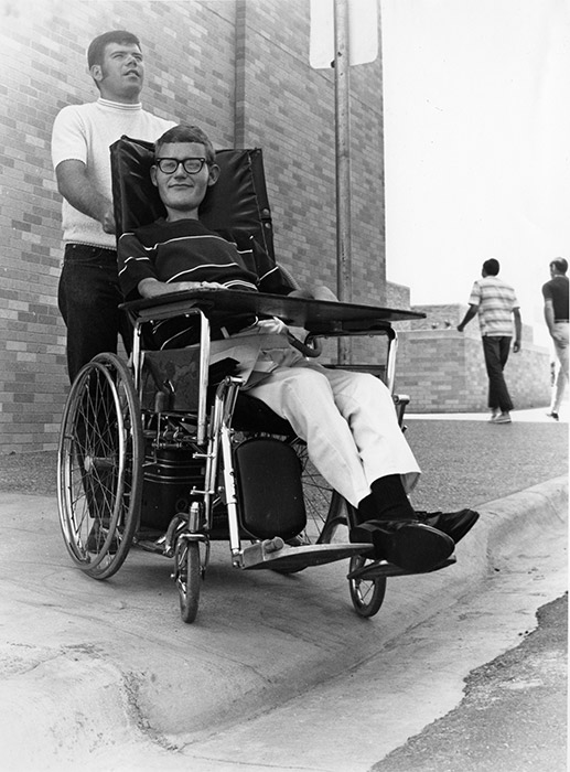 Sam Provence (in wheelchair) was chairman of UTA’s Handicapped Students Association in the early 1970s. He helped launch a statewide campaign against physical barriers on college campuses.