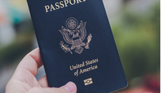 Hand holding a U.S. passport