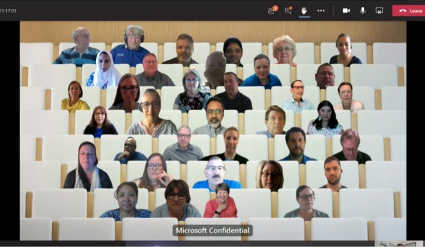Microsoft Teams' Together Mode shows individuals as if they are in stadiium seating.