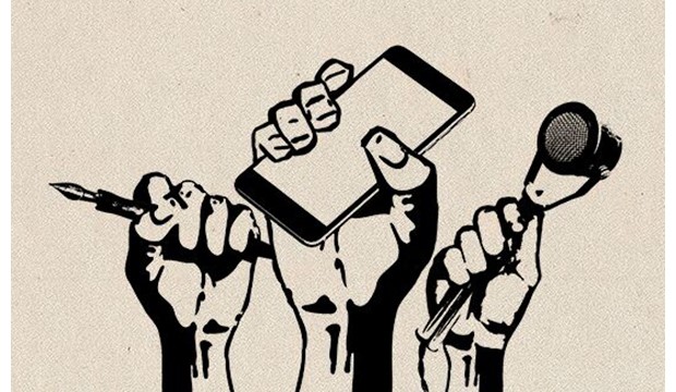 Hands holding a pen, a cellphone, and a microphone representing Free Speech.