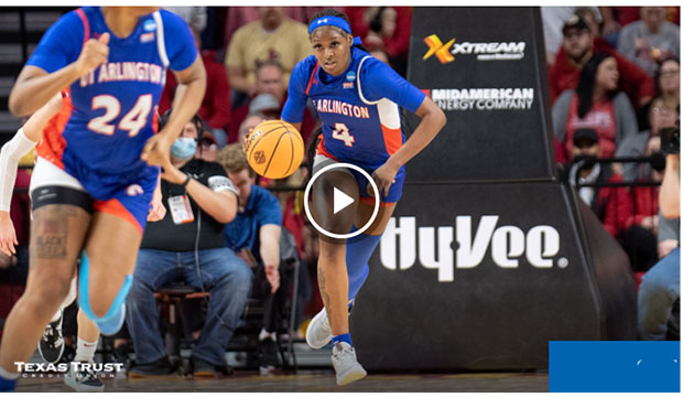Lady Maverick basketball player dribbling down court.