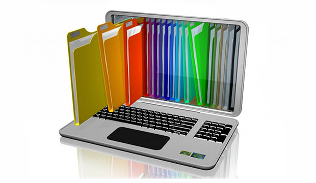 Graphic of laptop with colorful paper folders going into it.