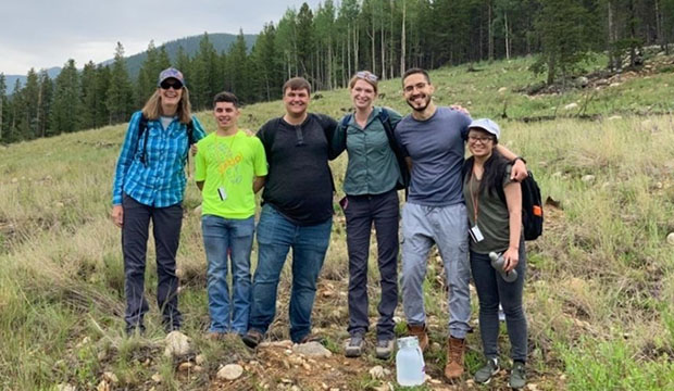 Group of engineering students in outdoors of Rocky Mountains in Colorado.