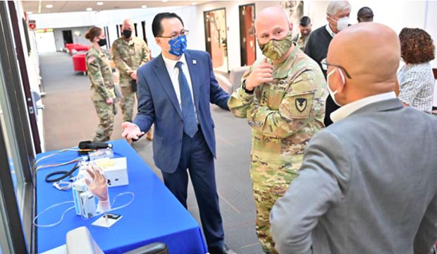 From left, UTA Interim President Teik C. Lim, Gen. Edward M. Daly and Muthu Wijesundara.