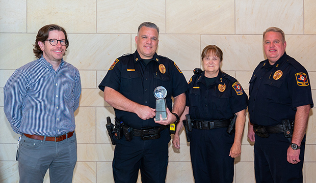 Nolan Brett, Cpt. Mike McCord, Chief Kim Lemaux, and Assistant Chief Jay Tillerson
