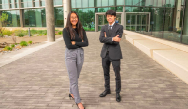 Two of five UTA students who participated in an investment management program hosted by the University of Texas and Texas A&M.