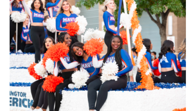 Cheerleaders on Homecoming float