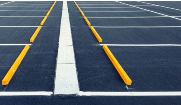A resurfaced and repainted parking lot.