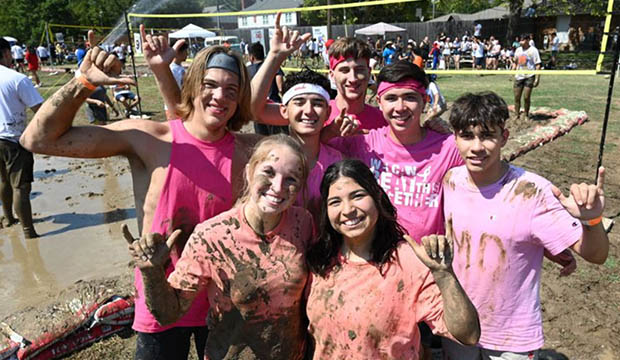 Muddy Oozeball participants pose for the camera.