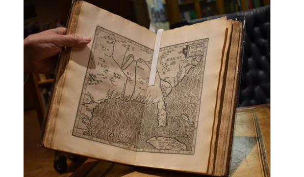 Open book showing early Texas map