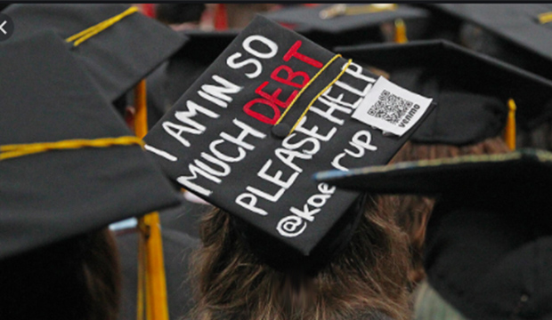 Graduating student's mortarboard cap with "I'm So In Debt. Please help."