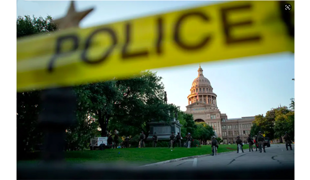 Texas state capital with police tape.