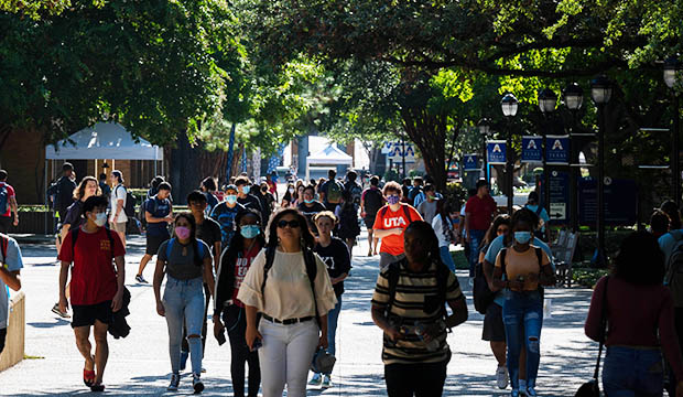 University Center mall filled with students, some wearing masks and others not.