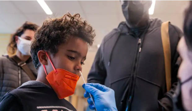 Child receiving a COVID-19 test nasal swab.