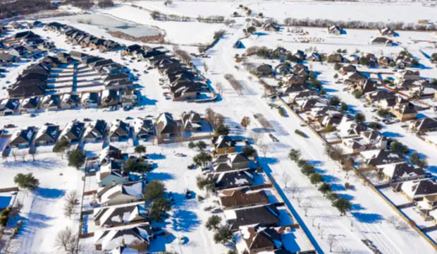 Snow covered subdivision seen from above.