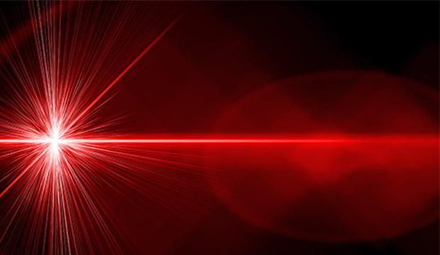 red laser beam with spark on end