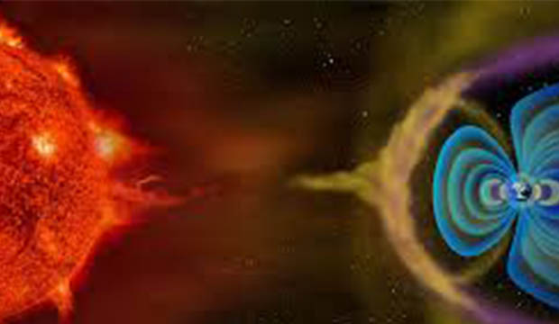 Sun with flares and Earth showing magnetic fields