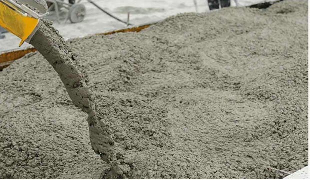 Cement being poured in a parking lot.
