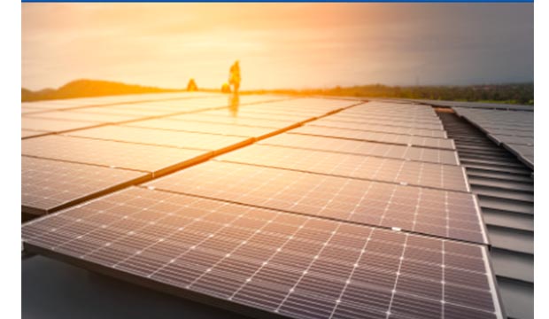 Sun rising on solar power panels.