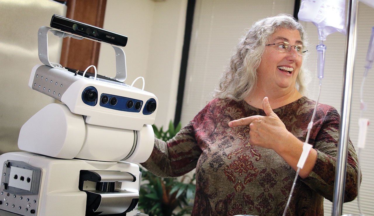 Deborah Behan and the robotic aide