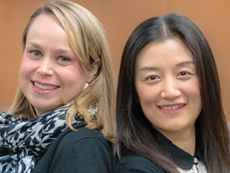 Noelle Fields and Ling Xu, social work associate professors