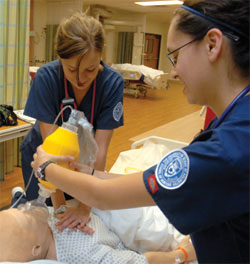 Students apply bag mask to patient