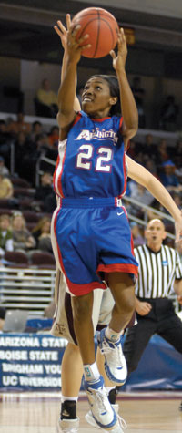 Terra Wallace of the Mavericks shoots over an attempted block Terra Wallace of the Mavericks shoots over an attempted block