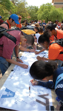 Students sign Virginia Tech banner Students sign Virginia Tech banner