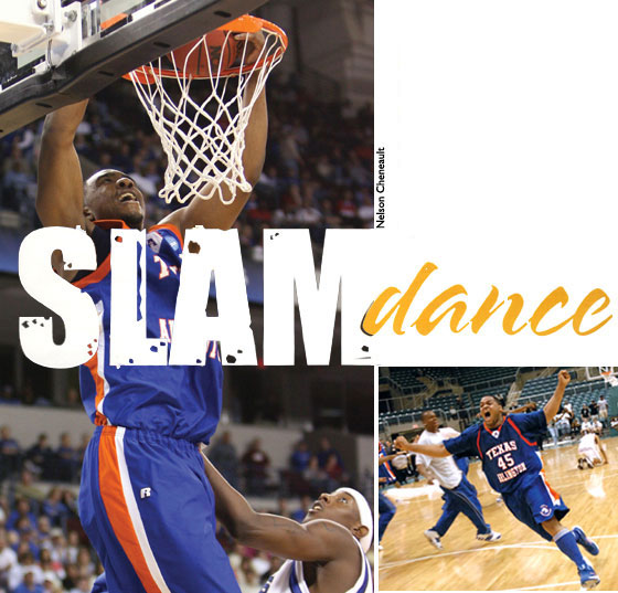 UT Arlington player dunks basketball in game.