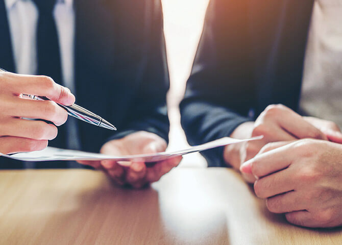 people looking at papers