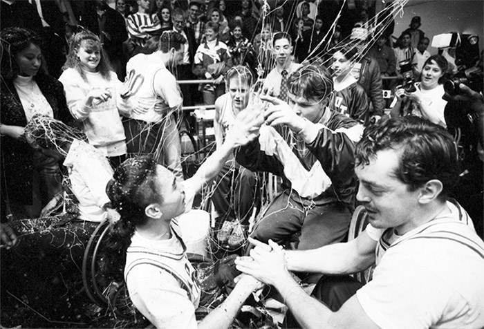 The Movin’ Mavs wheelchair basketball team celebrates its Final Four victory in 1994.