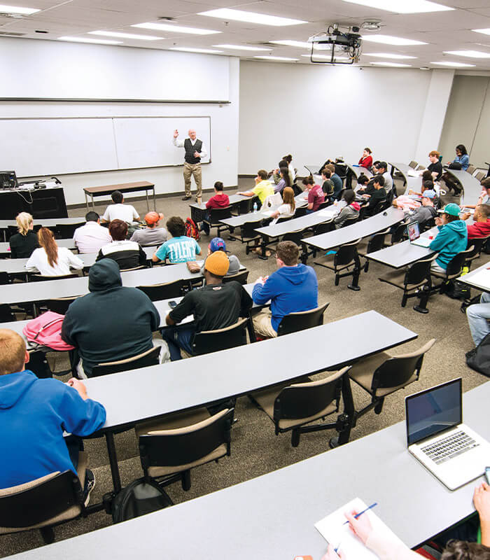 Professor teaching class of students