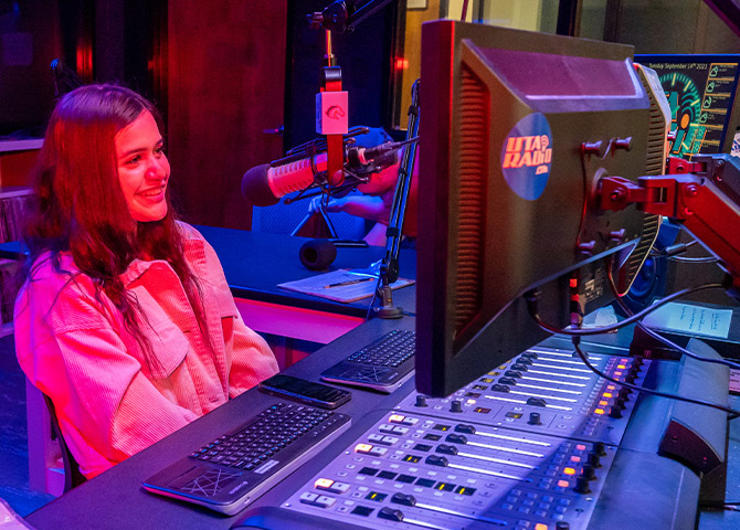 Brenda Saldana mans the controls as news director for UTA Radio.