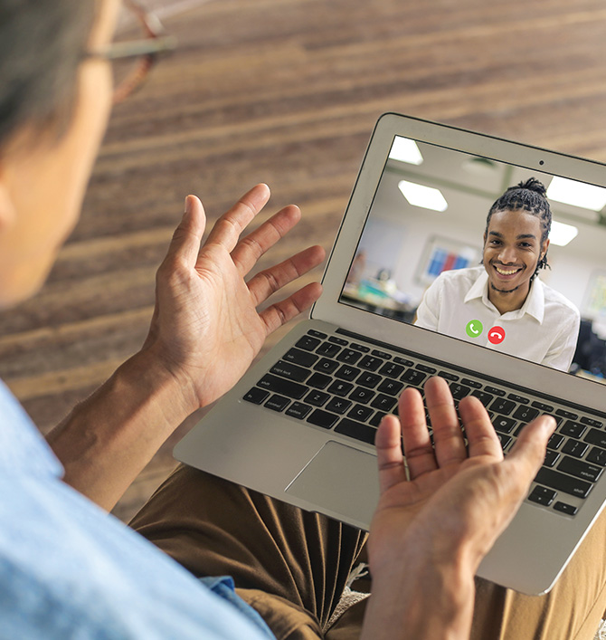Photo of people chatting on computer